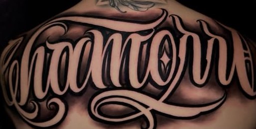 Custom script tattoo, upper back