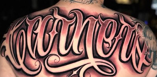 Custom script tattoo, upper back
