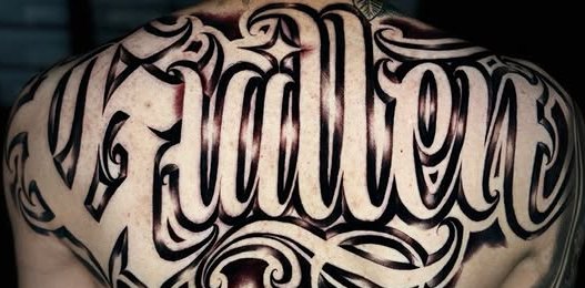 Custom script tattoo, upper back