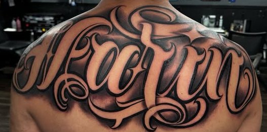 Custom script tattoo, upper back