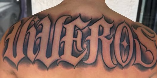 Custom script tattoo, upper back